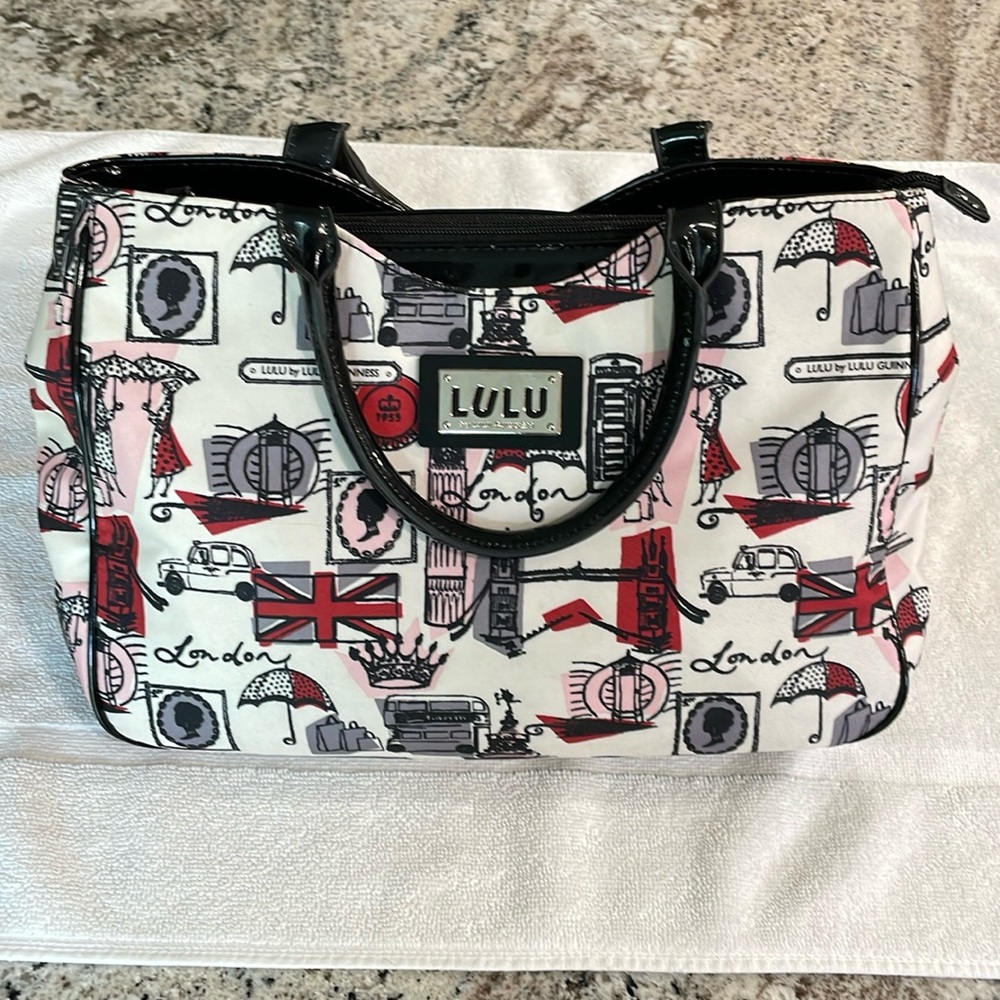 A Like New Lulu Guinness Purse. London pictures & expressions in the fabric.